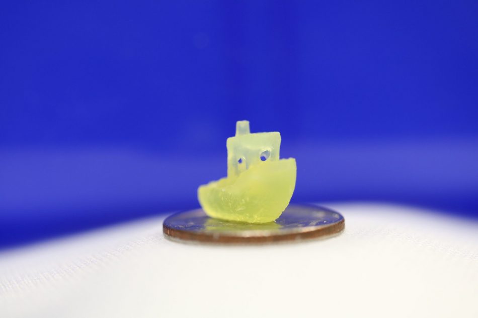 A volumetric 3D printed yellow boat.