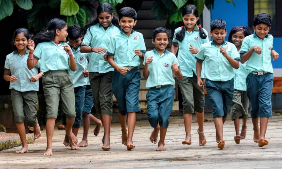 students at Valayanchirangara primary school walk comfortably in unisex uniforms