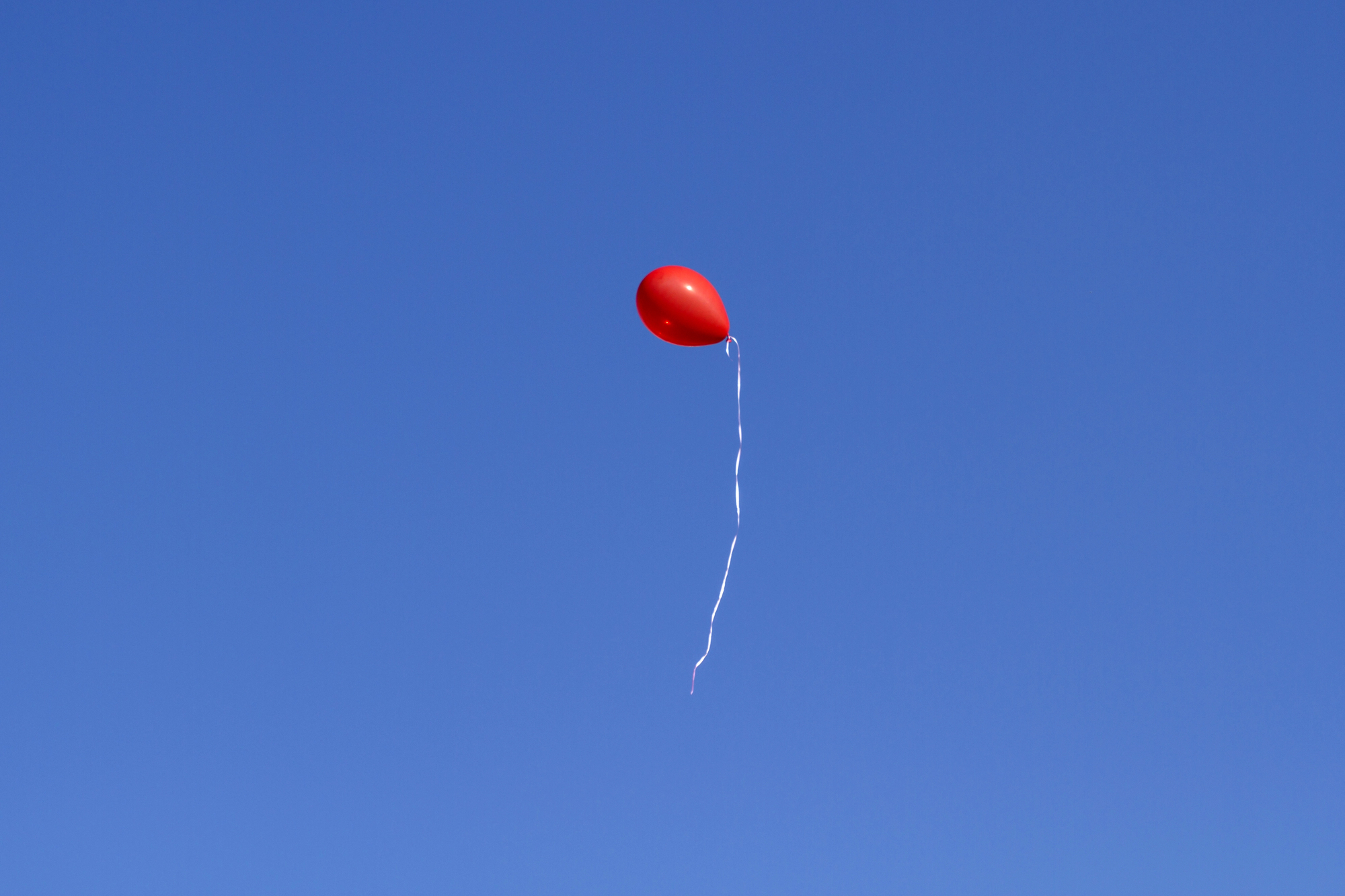 Balloon floating in air representing the UK's new biodegradable balloon alternative to traditional latex party balloons