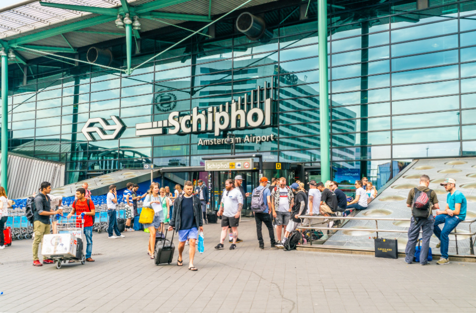 Schiphol, The Netherlands May 27 2018 - Passengers entering and leaving the main building at Schiphol airport in Amsterdam