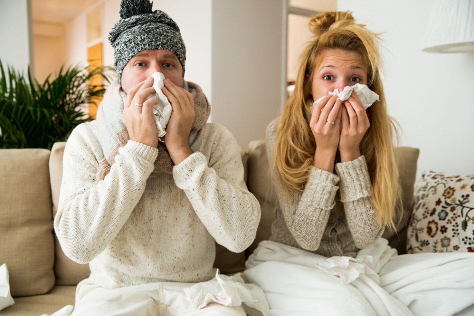 Sick couple catch cold. Man and woman sneezing, coughing. People got flu, having runny nose.