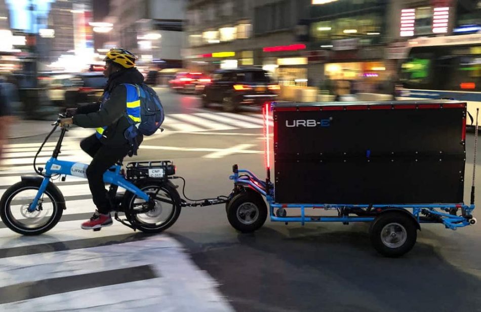 Delivery rider on an electric cargo bike in the center of the city