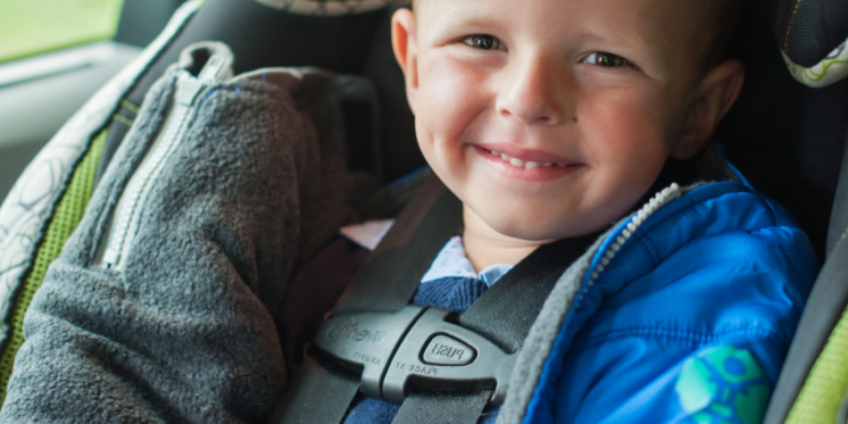 child sitting in car seat
