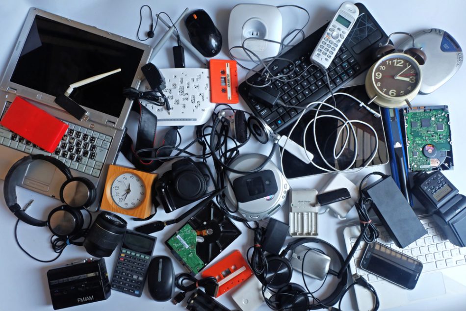 Pile of used Electronic Waste on white background.