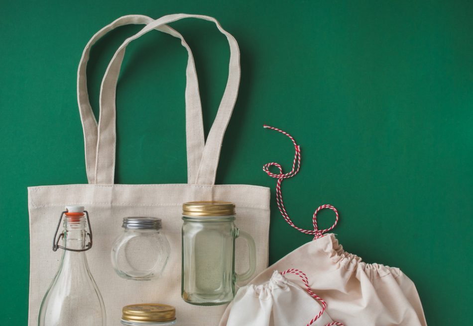Cotton bags and glass gar for free plastic shopping, low-waste concept.