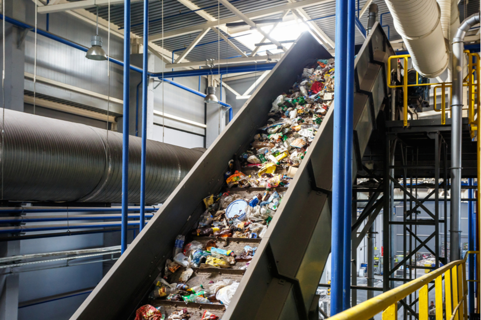 Plastic on conveyor belt at recycling facility