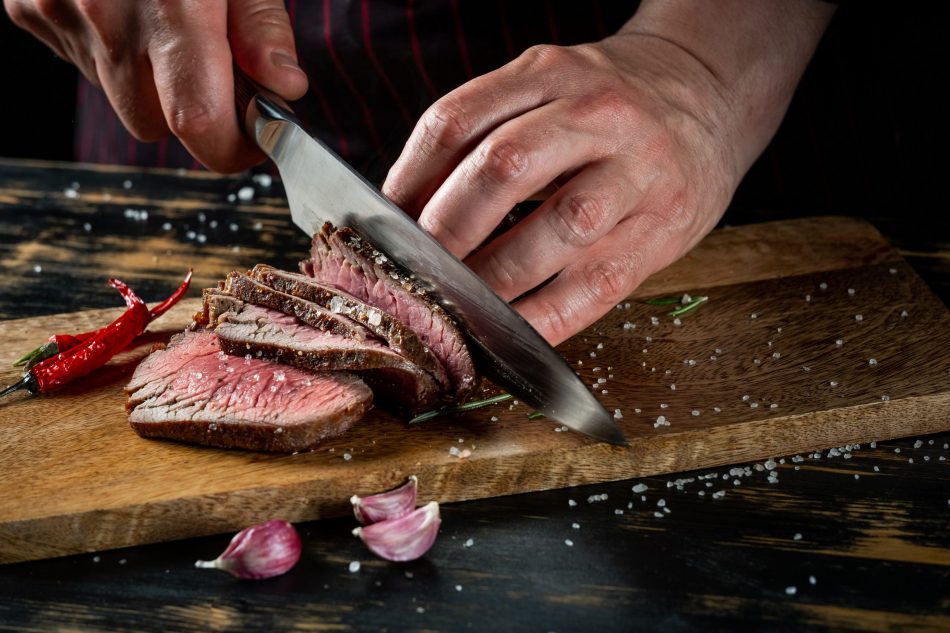 cutting steak with steak knife