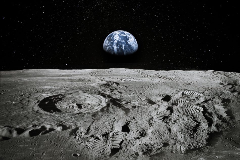 View of the moon with Earth rising on the horizon surrounded by the darkness of spcace.