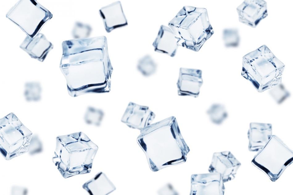 Falling ice cube, isolated on white background.
