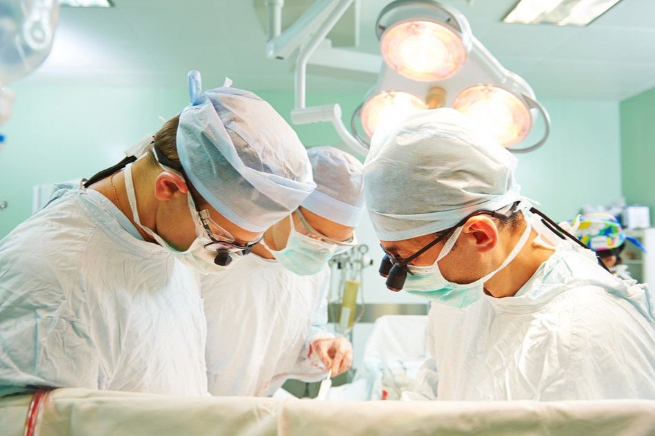 surgeons operate heart transplant