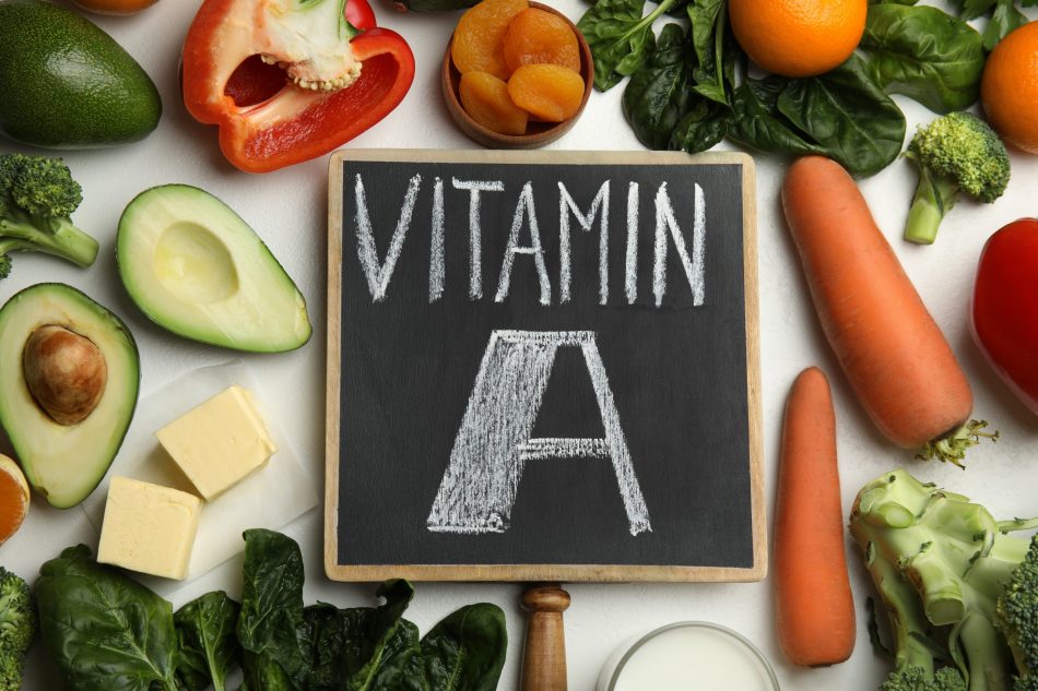 vitamin A rich foods surround a black board that reads VITAMIN A