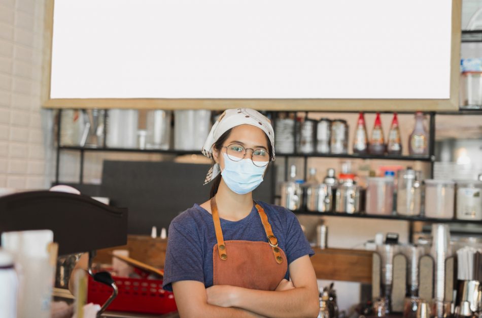 Restaurant worker wearing a mask and a bandana