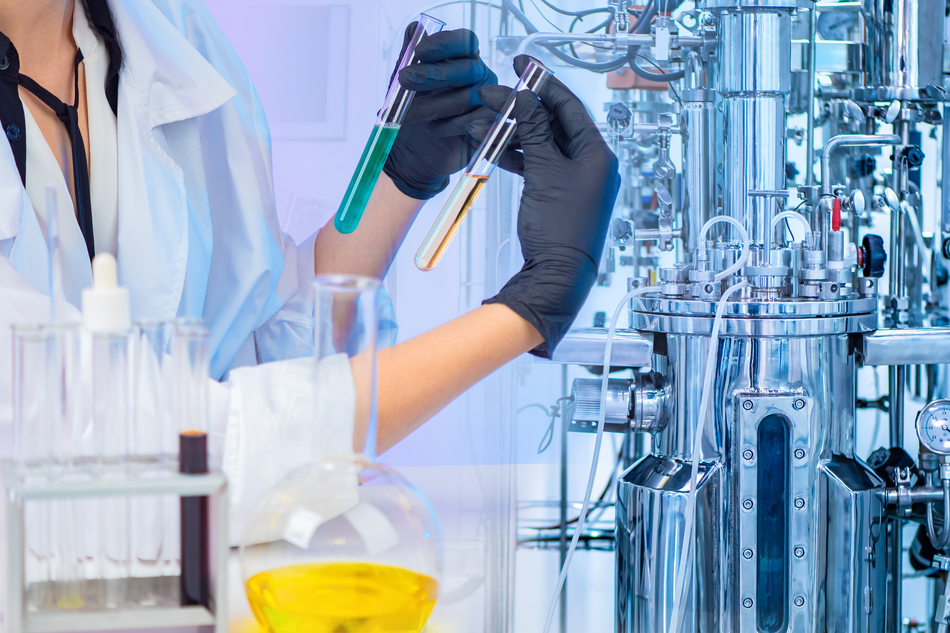 scientist engineering chemicals in test tubes in lab
