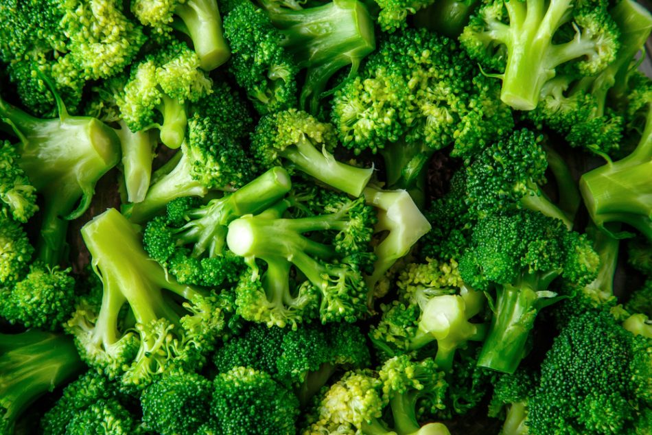 fresh vegetable broccoli. Fresh green broccoli on a black stone table.