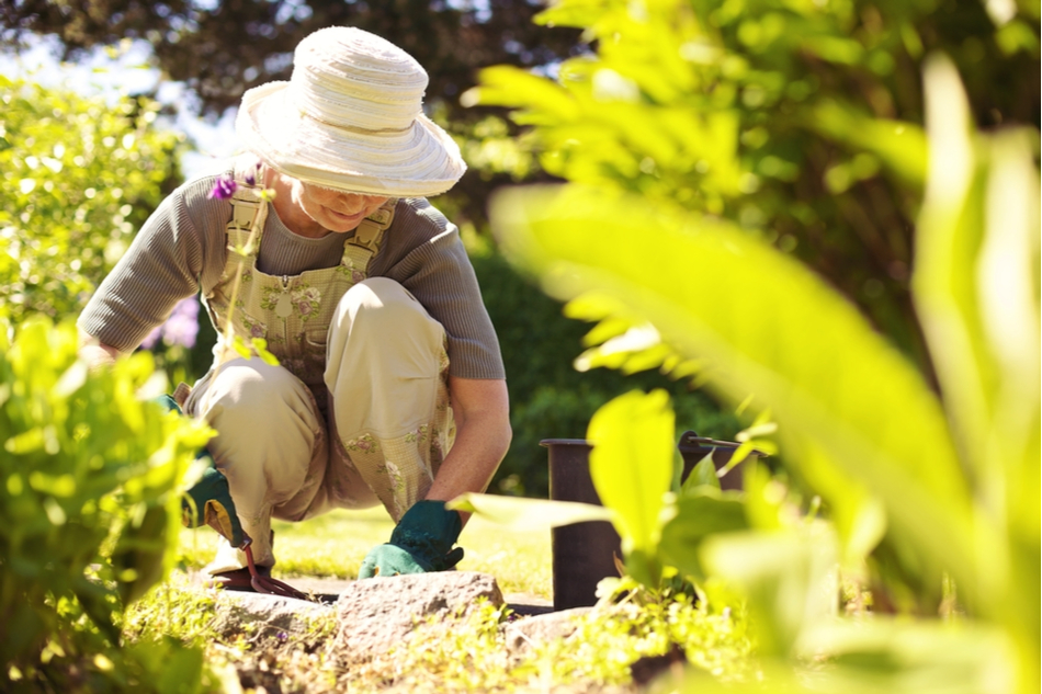 woman in overalls gardening