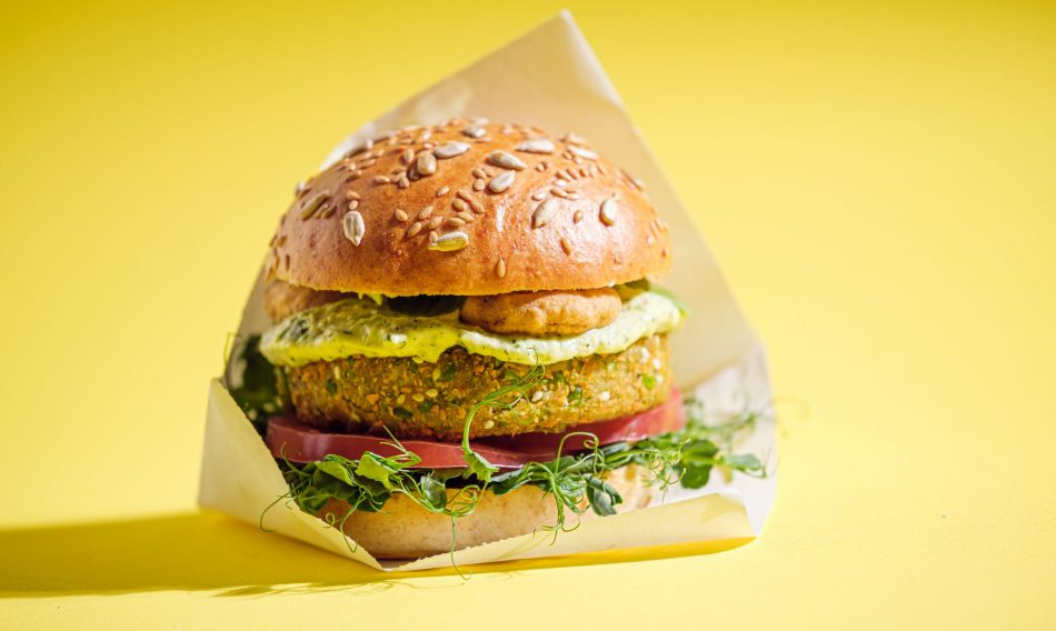 plant-based vegan burger against yellow backdrop
