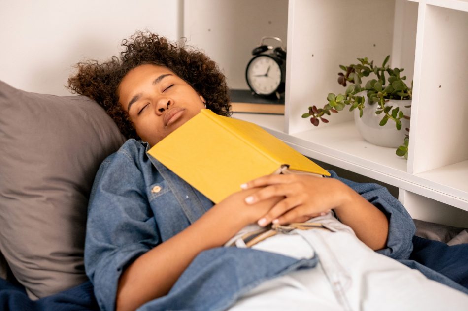 Sleeping teen with book