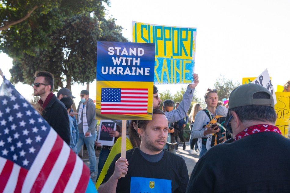 American citizens hold up supportive signs during rally for Ukraine