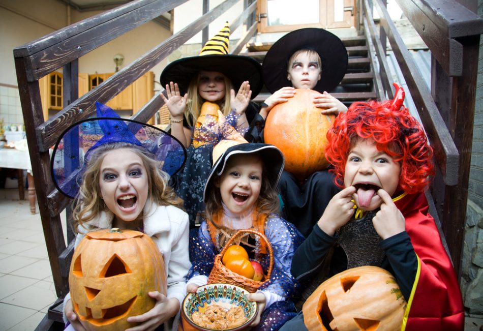 Children enjoying Halloween with costumes.
