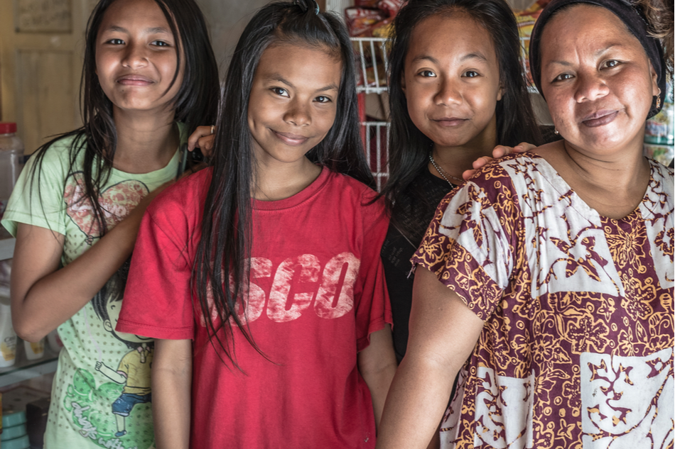 three young Indonesian girls and their mother