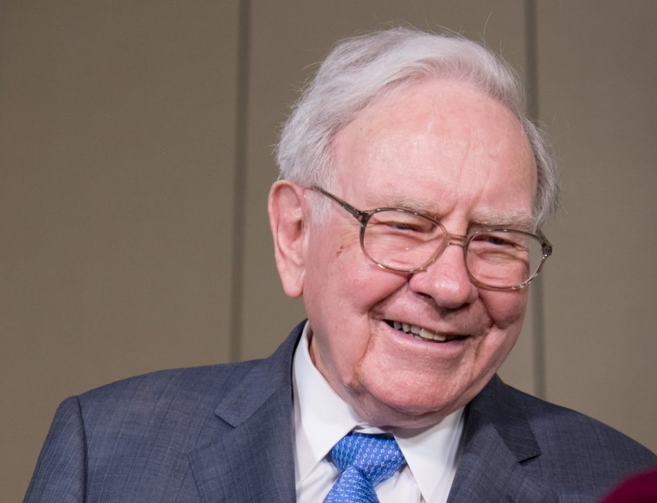Warren Buffett smiling in a suit