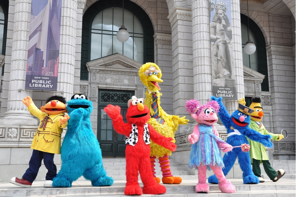 Sesame Street characters in front of public library