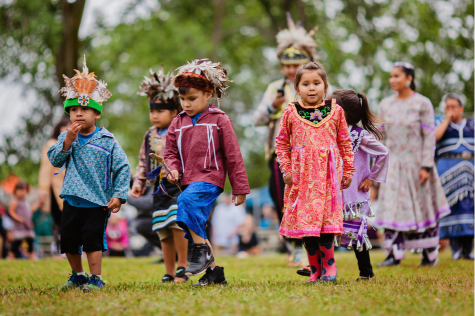 First Nations children dance at a Pow Wow in Quebec, Canada