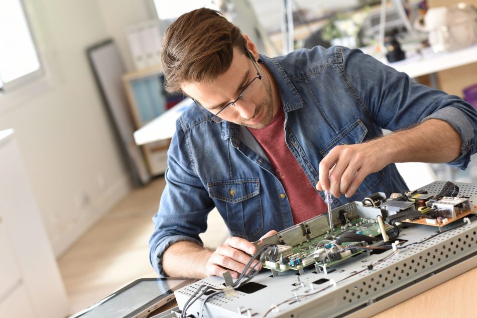 Man repairing electronics