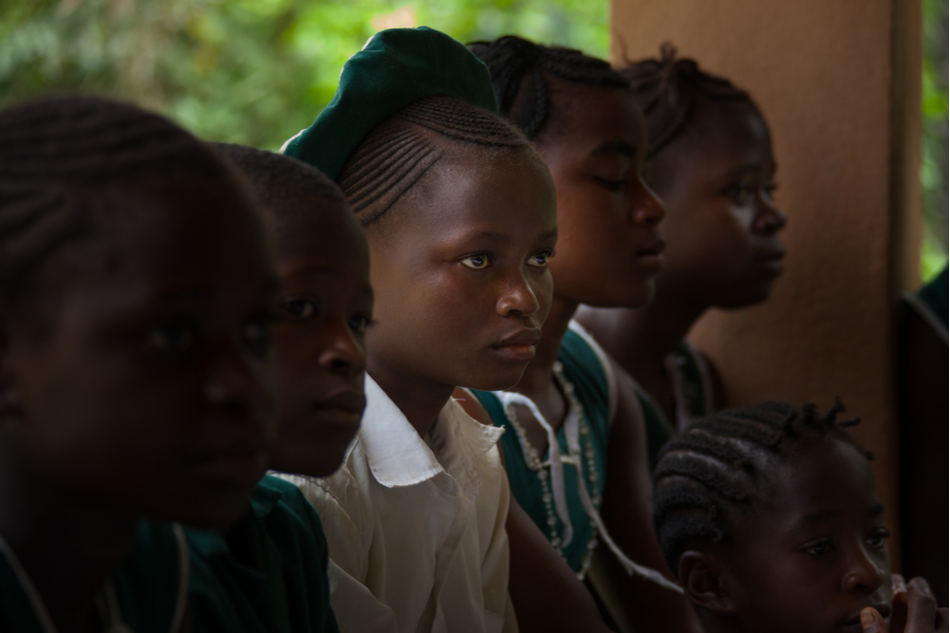 West Africa, the village of Yongoro, Sierra Leone, young girl listens to the lesson at school