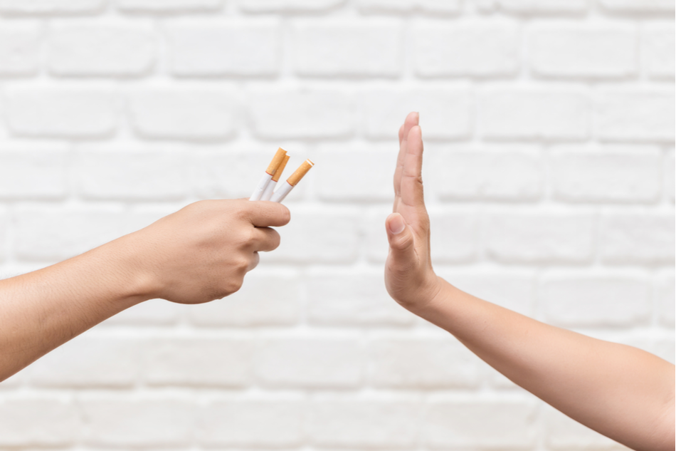 hand refusing other person's hand passing cigarettes