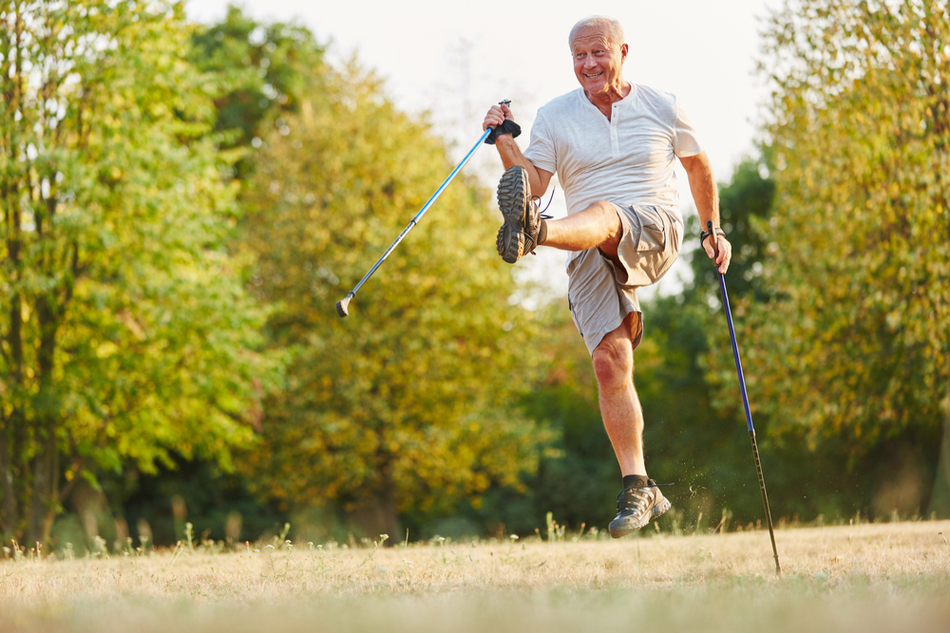 white Senior man has fun while taking outdoor walk