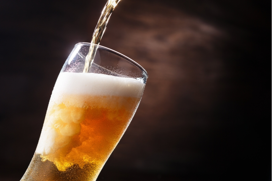 Up-close shot of beer being poured