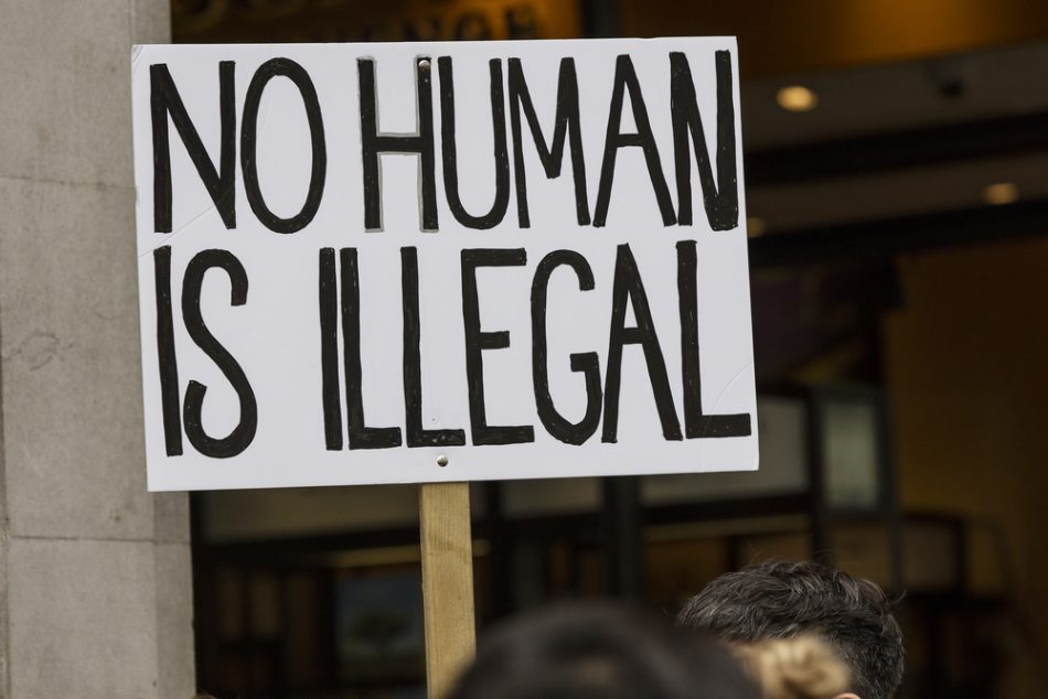 No Human is illegal protest banner at a political march.