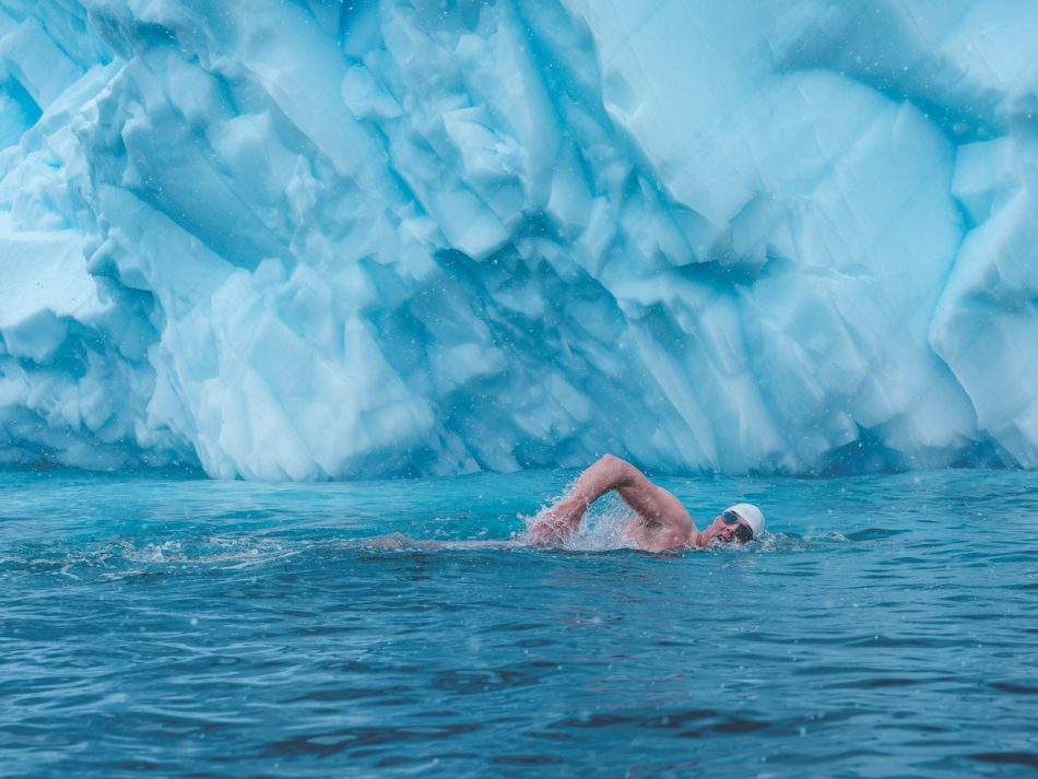 English swimmer and climate activist Lewis Pugh swims in glacial waters